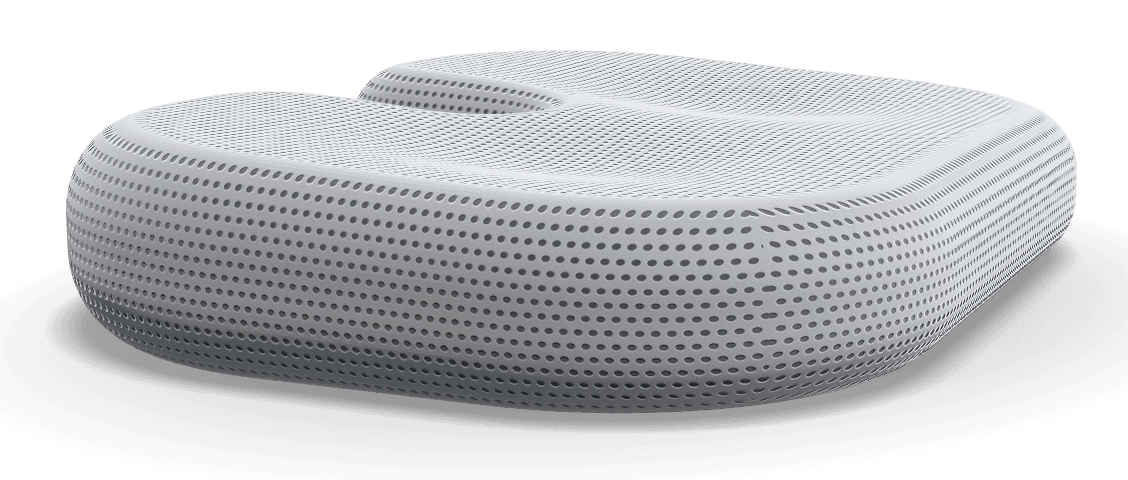 Grey cushion from the side, showing the contoured shape