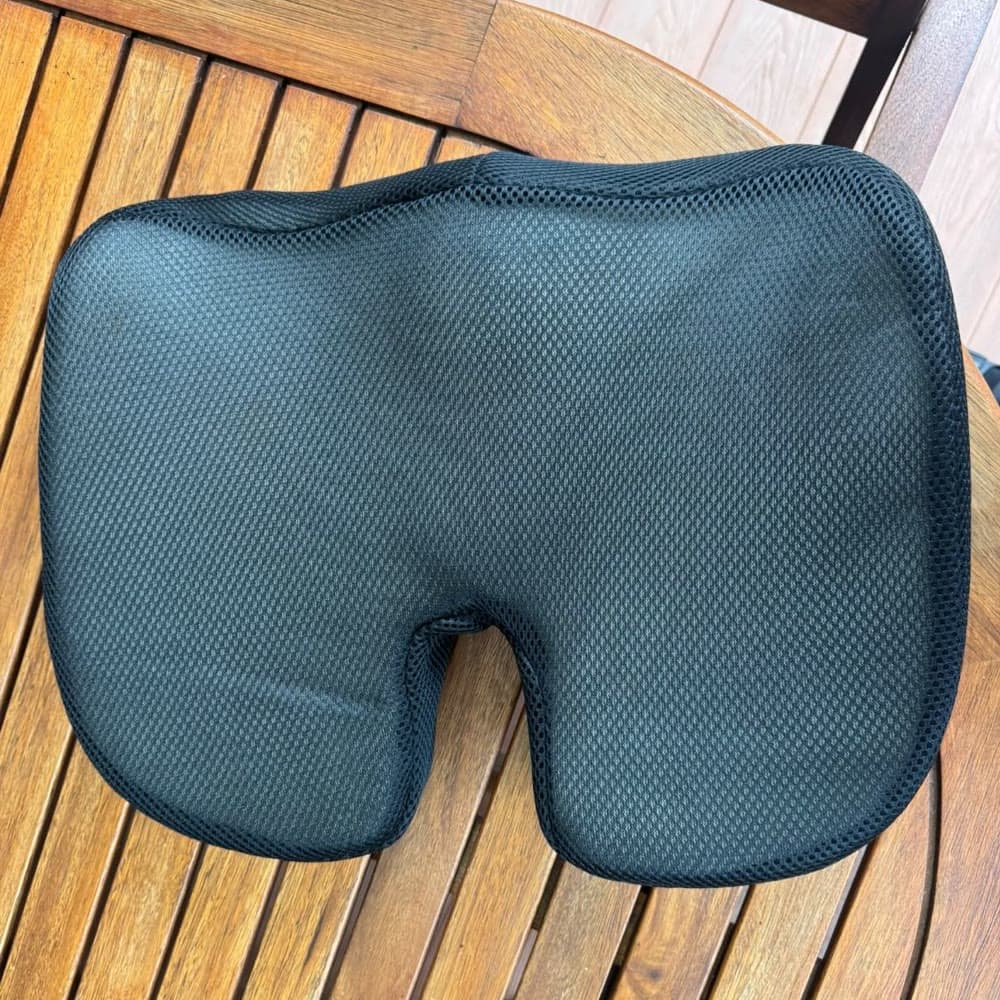 The cushion from above on a garden table